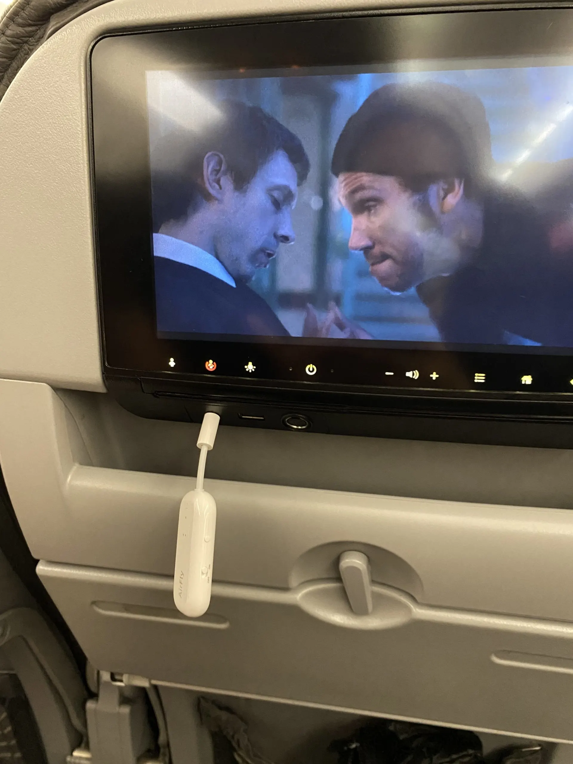 airpods on a plane 2 scaled.jpg