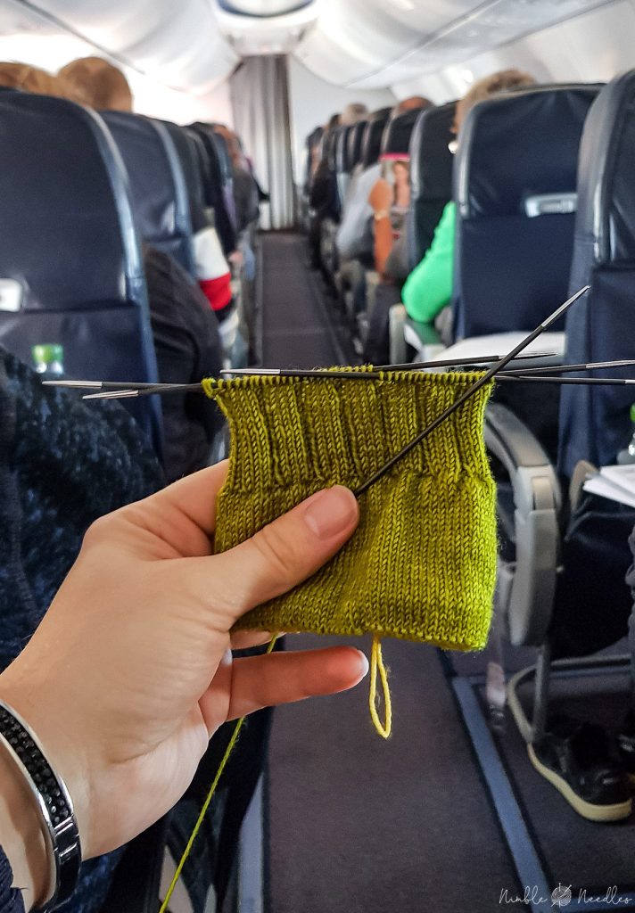 knitting socks on a plane 712x1024 1